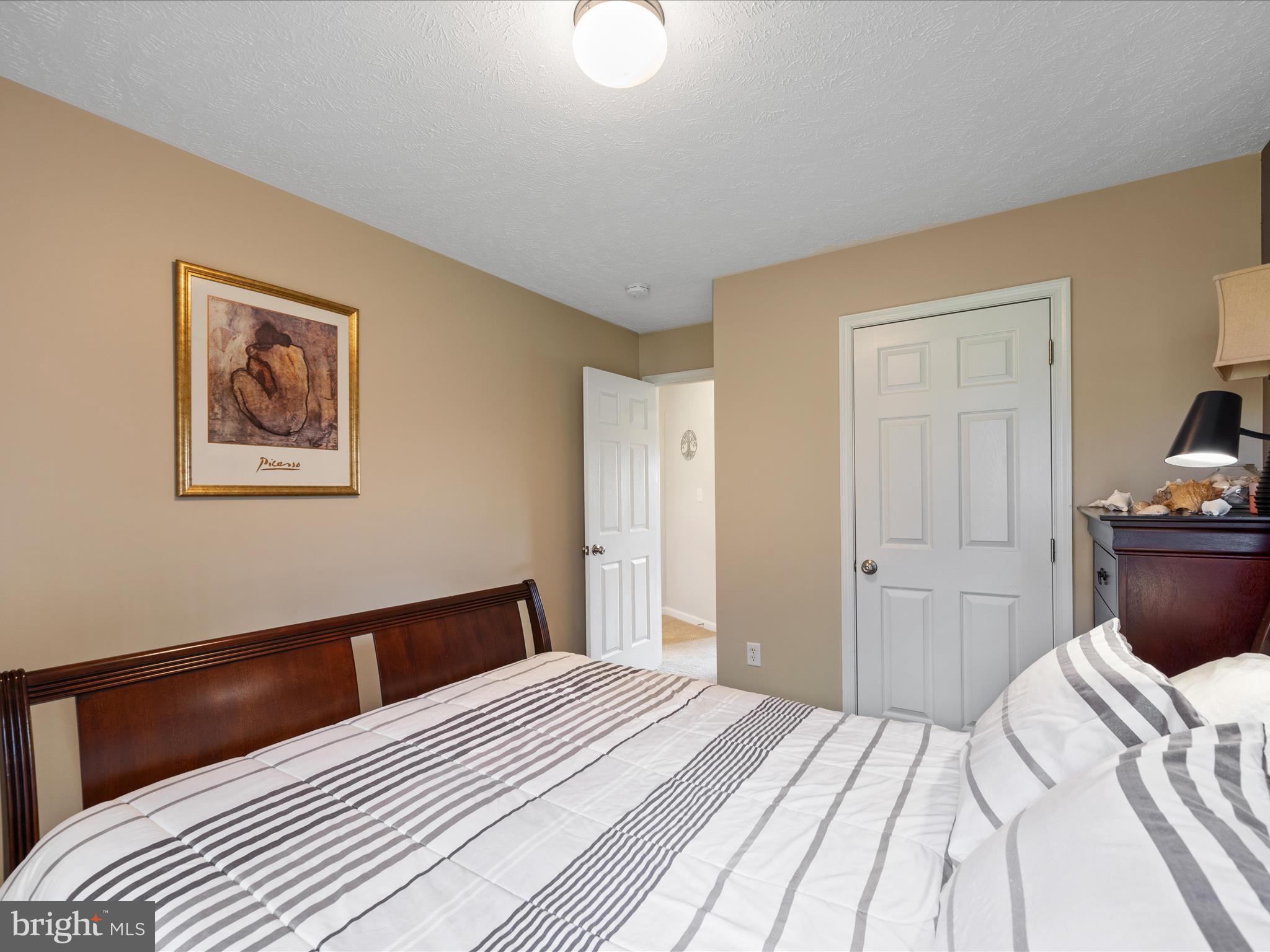993 Rockland Road Front Royal, VA 22630 - Photo 20 of 37 a bedroom with a bed and a chandelier