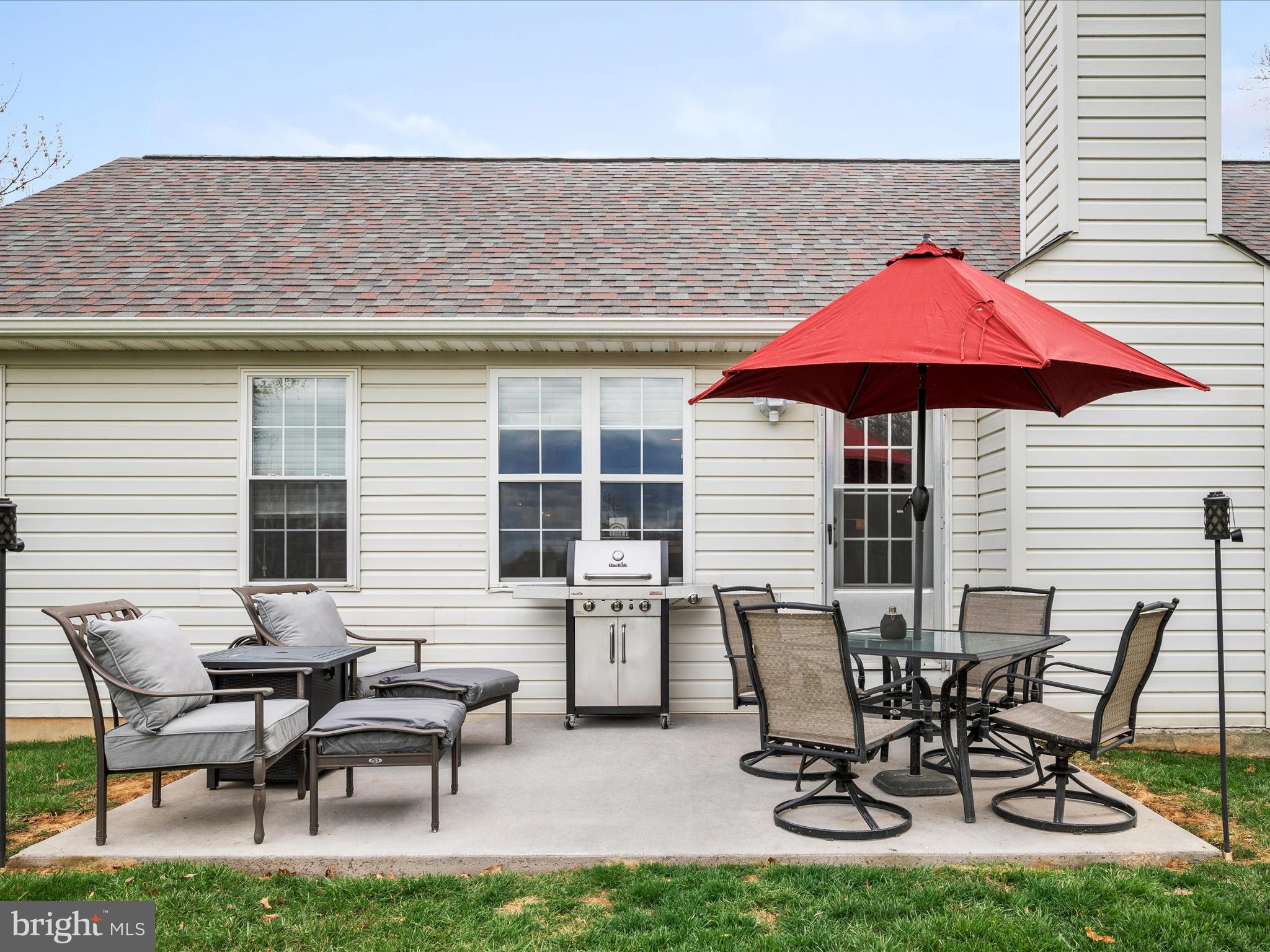 993 Rockland Road Front Royal, VA 22630 - Photo 25 of 37 a view of a patio with table and chairs under an umbrella