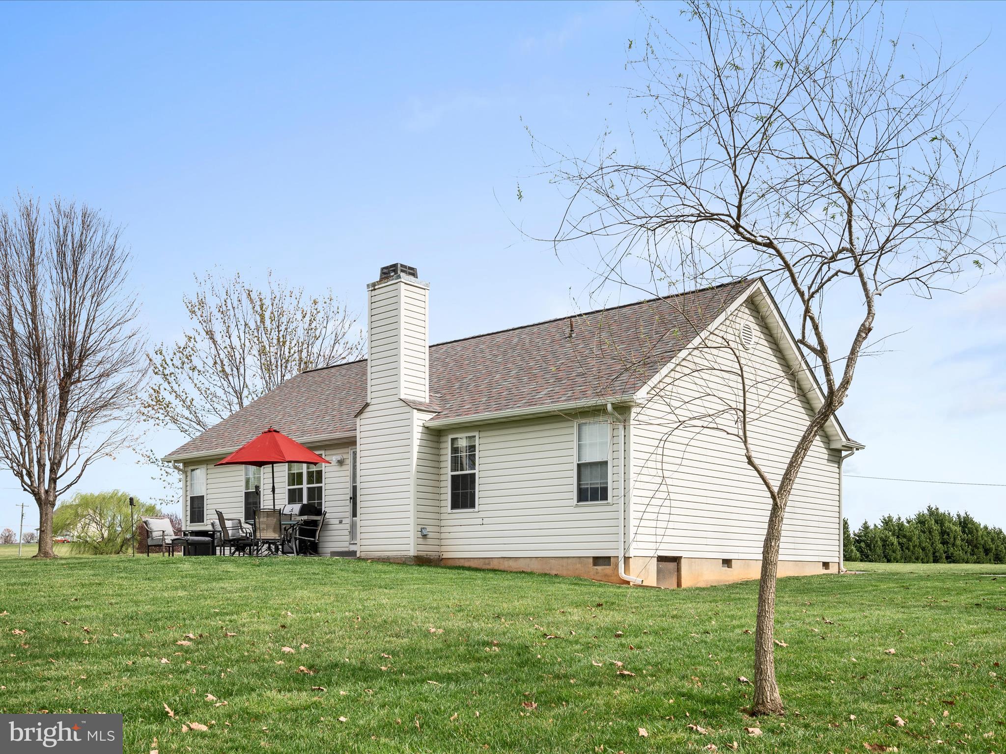 993 Rockland Road Front Royal, VA 22630 - Photo 29 of 37 a front view of a house with a yard and trees