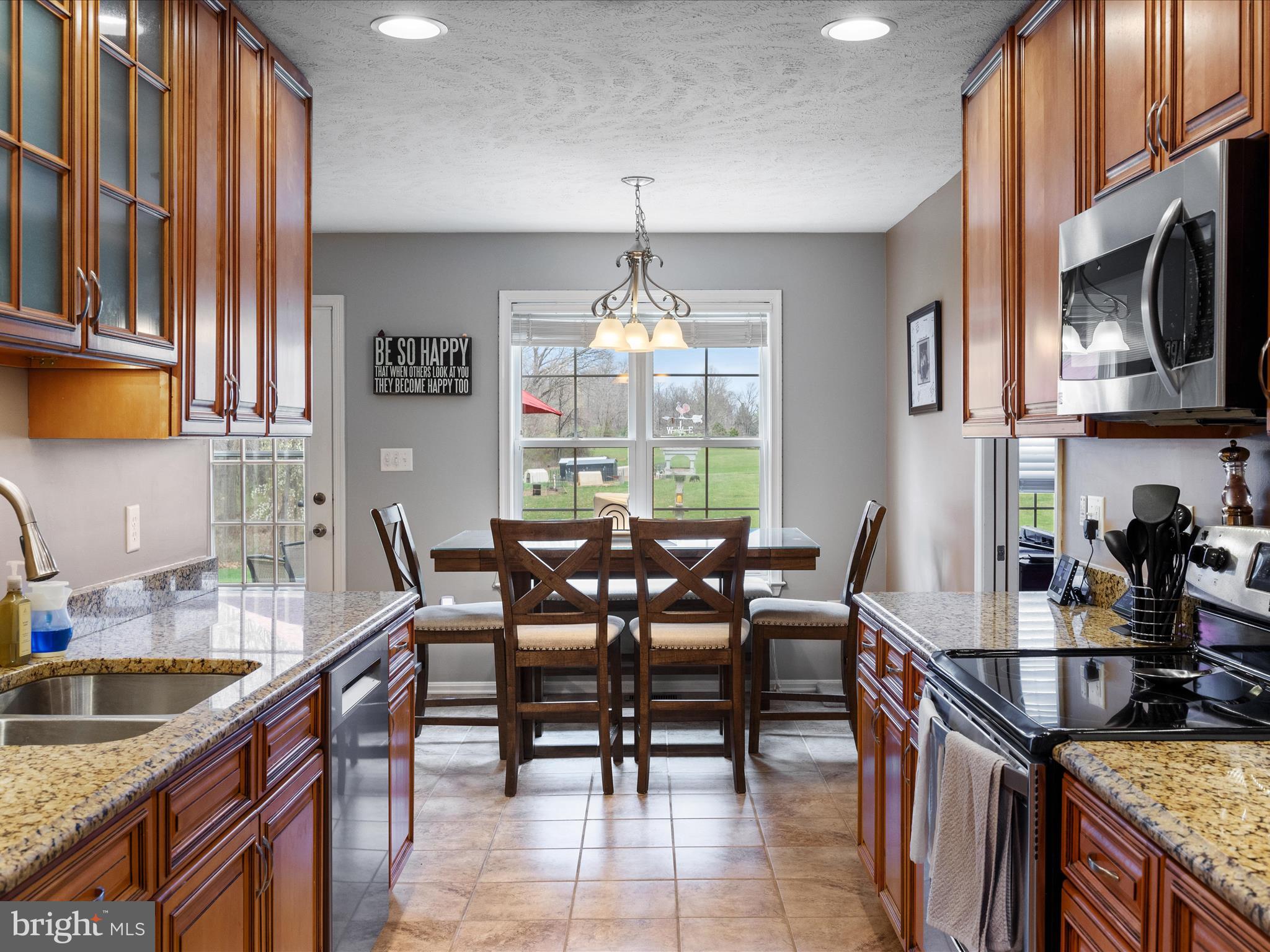 993 Rockland Road Front Royal, VA 22630 - Photo 6 of 37 a dining room with furniture a chandelier and window