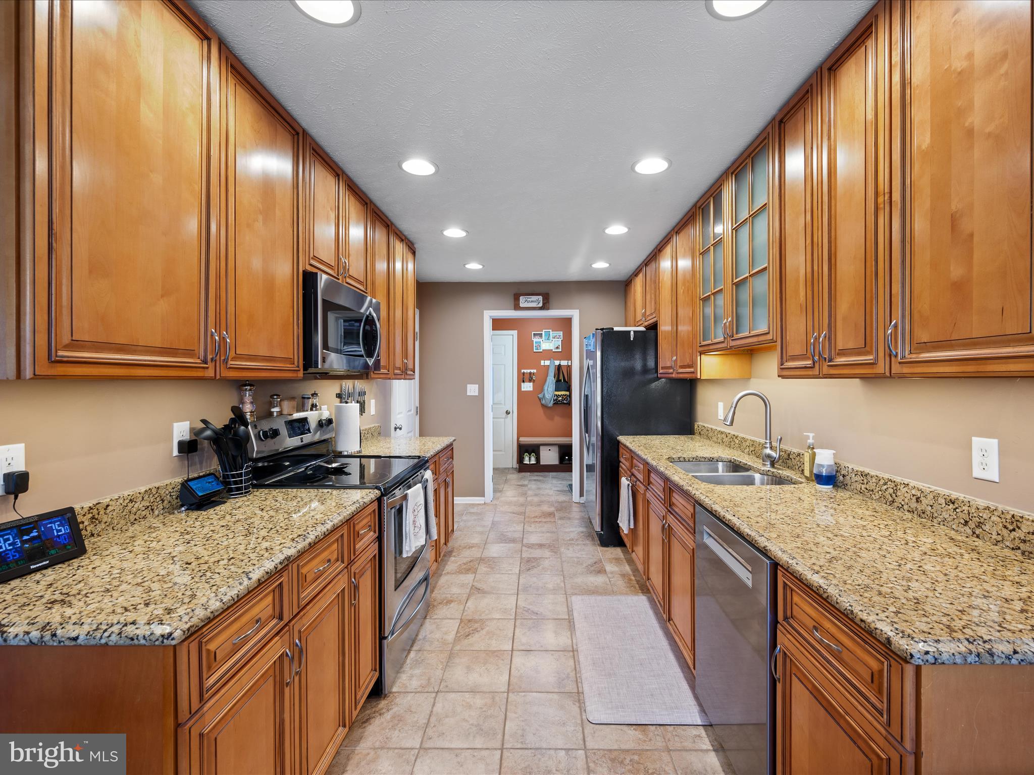 993 Rockland Road Front Royal, VA 22630 - Photo 7 of 37 a kitchen with stainless steel appliances granite countertop a stove sink and cabinets