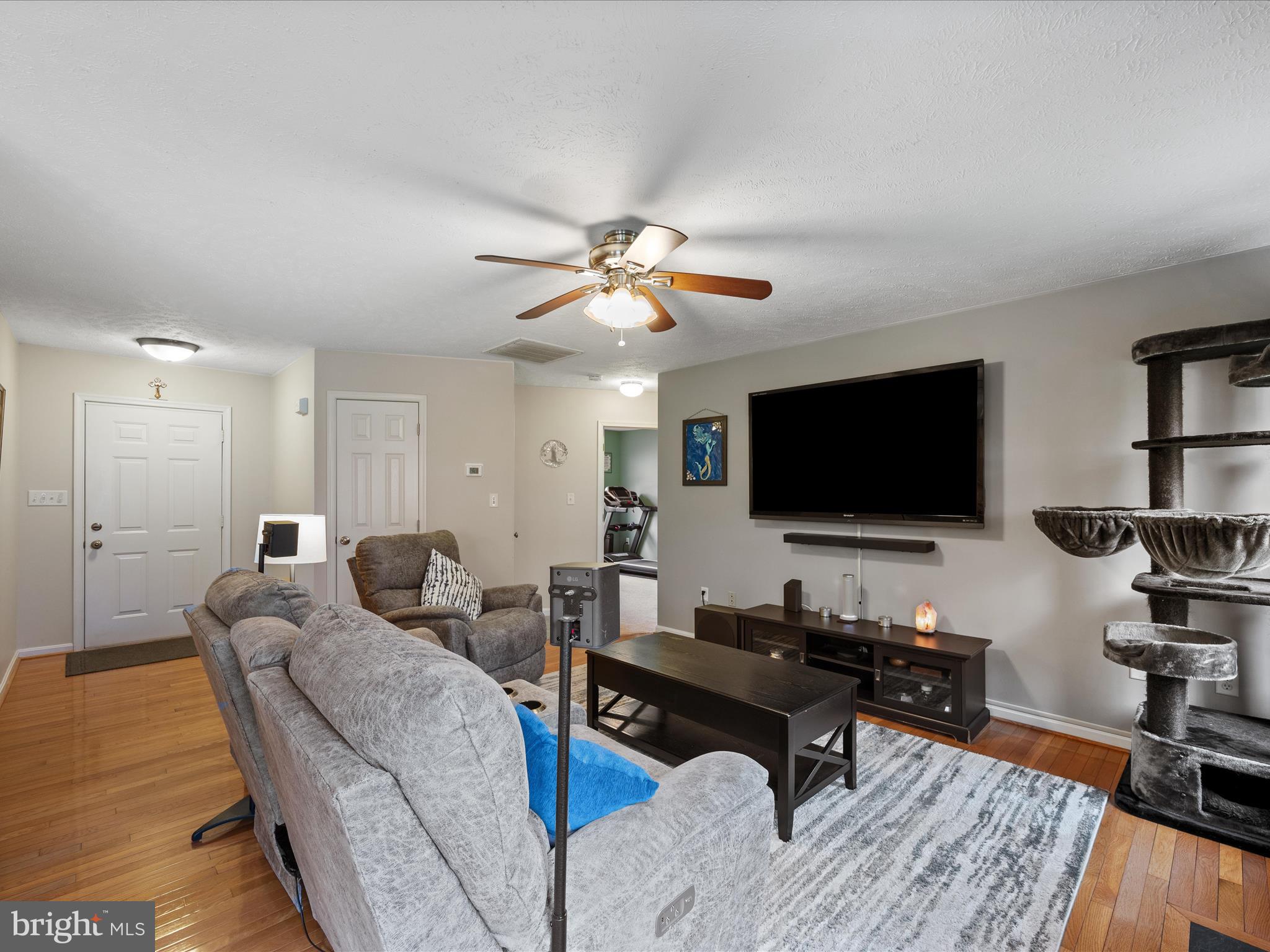 993 Rockland Road Front Royal, VA 22630 - Photo 9 of 37 a living room with furniture and a flat screen tv