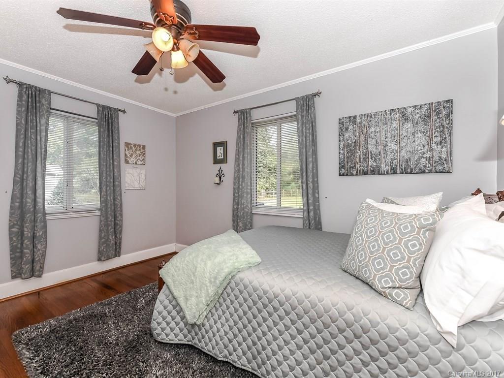 4419 Castleton Road Charlotte, NC 28211 - Photo 15 of 24 a bedroom with a large bed and a window