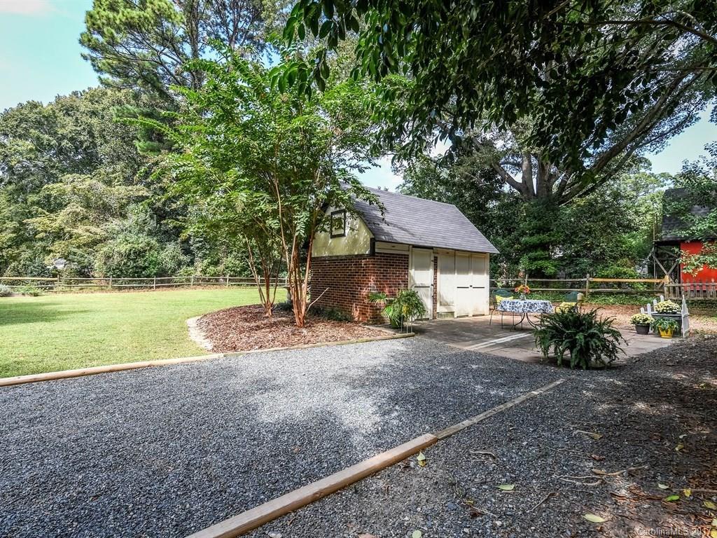 4419 Castleton Road Charlotte, NC 28211 - Photo 22 of 24 a view of a house with backyard and sitting area