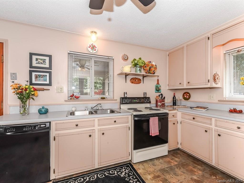 4419 Castleton Road Charlotte, NC 28211 - Photo 9 of 24 a kitchen with a sink stove and cabinets