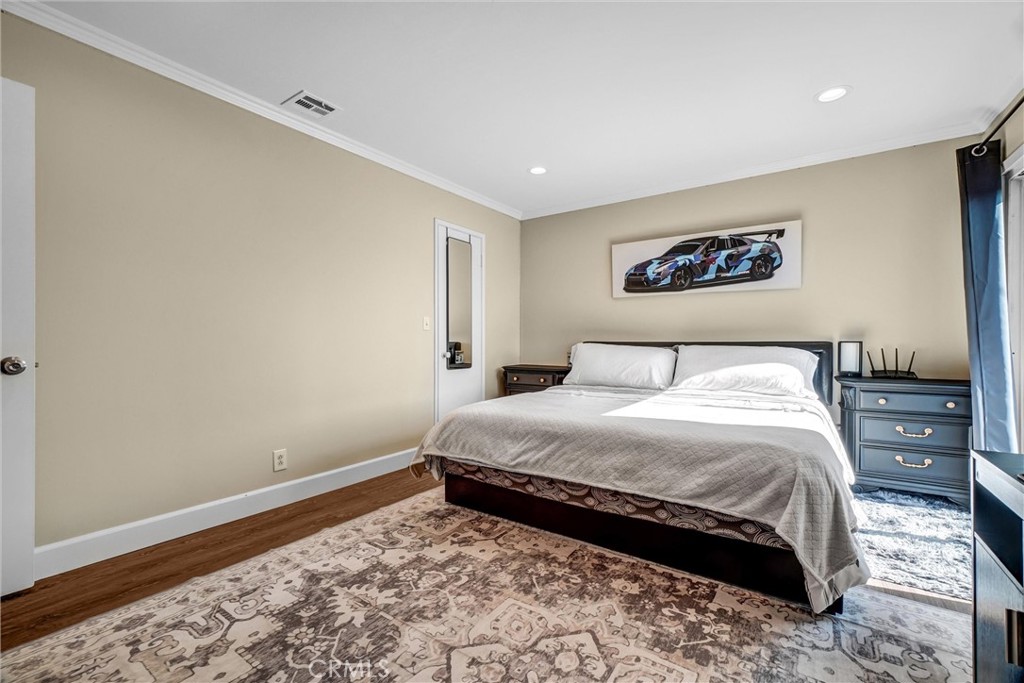 10661 Ritter Street Cypress, CA 90630 - Photo 21 of 32 Upstairs primary bedroom with ensuite bath and sun deck access