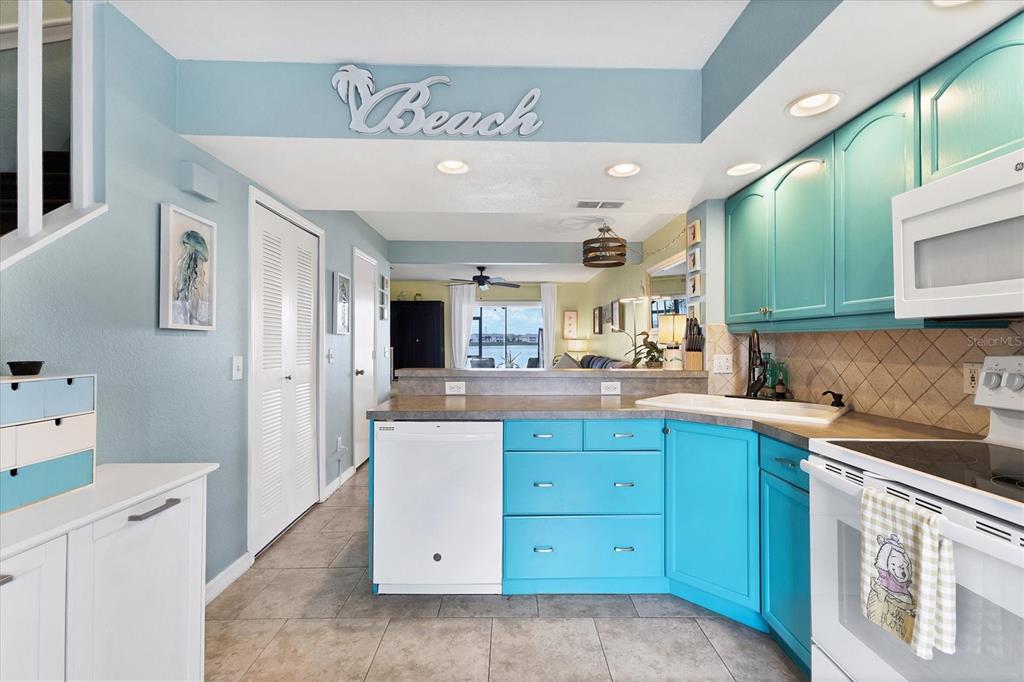 26310 Rampart Boulevard, Unit D504 Punta Gorda, FL 33983 - Photo 17 of 46 a kitchen with cabinets a sink and appliances