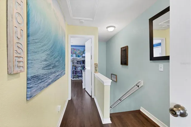 a spacious bedroom with a bed and a dresser