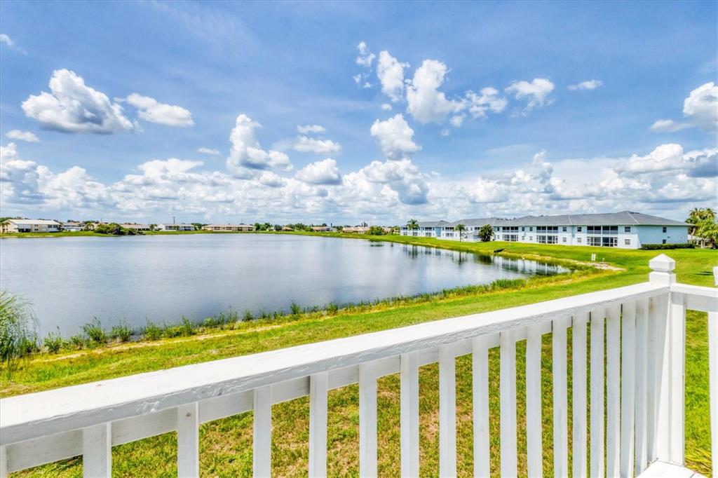 26310 Rampart Boulevard, Unit D504 Punta Gorda, FL 33983 - Photo 24 of 46 a view of swimming pool with outdoor seating and yard