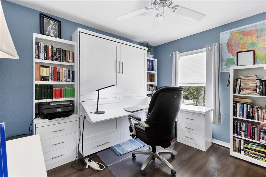 26310 Rampart Boulevard, Unit D504 Punta Gorda, FL 33983 - Photo 28 of 46 a view of a workspace with furniture and a bookshelf