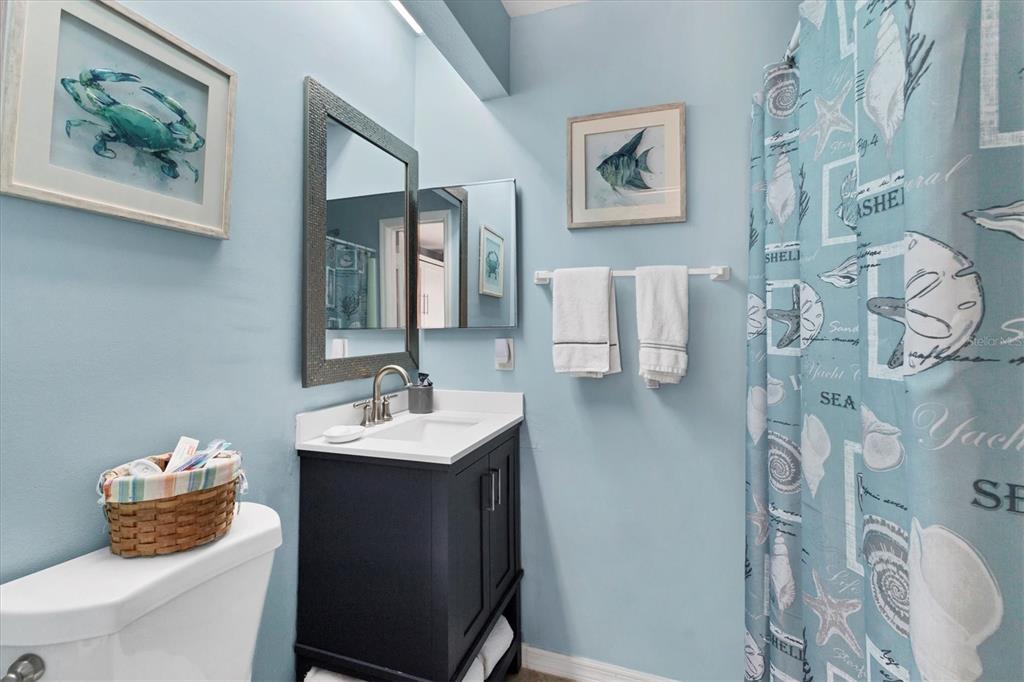 26310 Rampart Boulevard, Unit D504 Punta Gorda, FL 33983 - Photo 29 of 46 a bathroom with a sink and a mirror