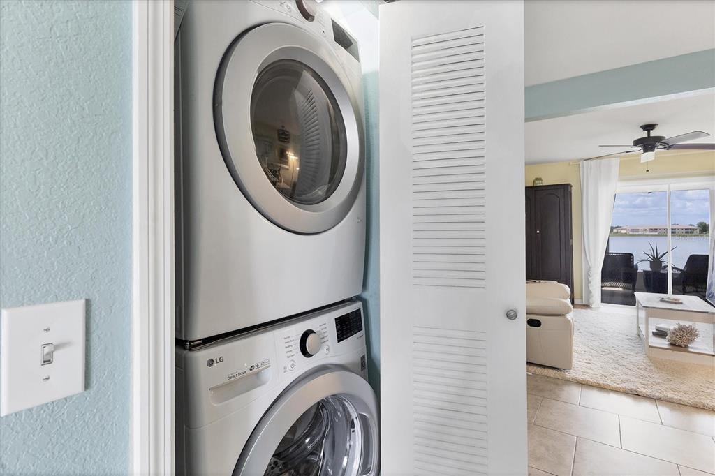 26310 Rampart Boulevard, Unit D504 Punta Gorda, FL 33983 - Photo 31 of 46 a utility room with dryer and washer