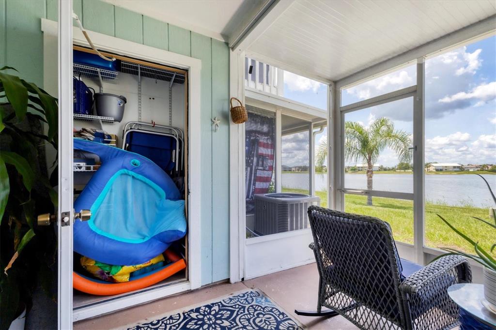 26310 Rampart Boulevard, Unit D504 Punta Gorda, FL 33983 - Photo 32 of 46 a living room with furniture and a floor to ceiling window