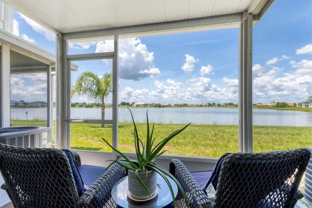 26310 Rampart Boulevard, Unit D504 Punta Gorda, FL 33983 - Photo 34 of 46 a view of a city from a dining room with large windows