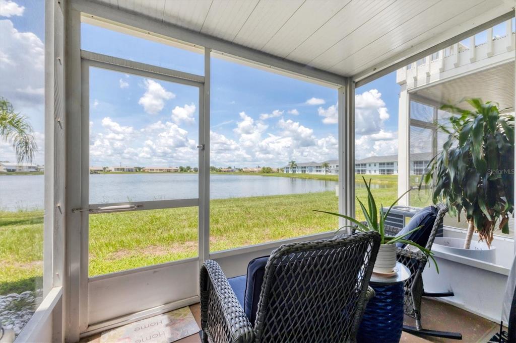26310 Rampart Boulevard, Unit D504 Punta Gorda, FL 33983 - Photo 35 of 46 a view of a city from a dining room with large windows