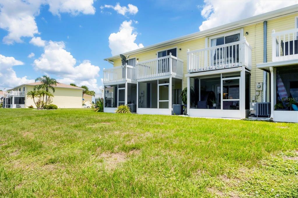 26310 Rampart Boulevard, Unit D504 Punta Gorda, FL 33983 - Photo 37 of 46 a front view of a house with a garden