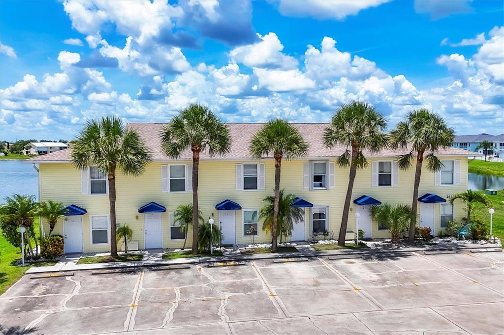 26310 Rampart Boulevard, Unit D504 Punta Gorda, FL 33983 - Photo 4 of 46 a front view of house with yard