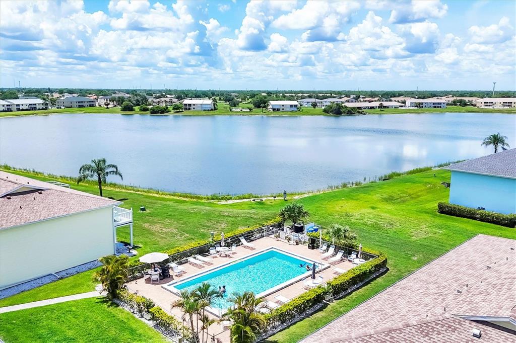 26310 Rampart Boulevard, Unit D504 Punta Gorda, FL 33983 - Photo 43 of 46 an aerial view of a house with a garden and lake view