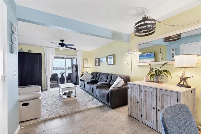 a living room with furniture and a table