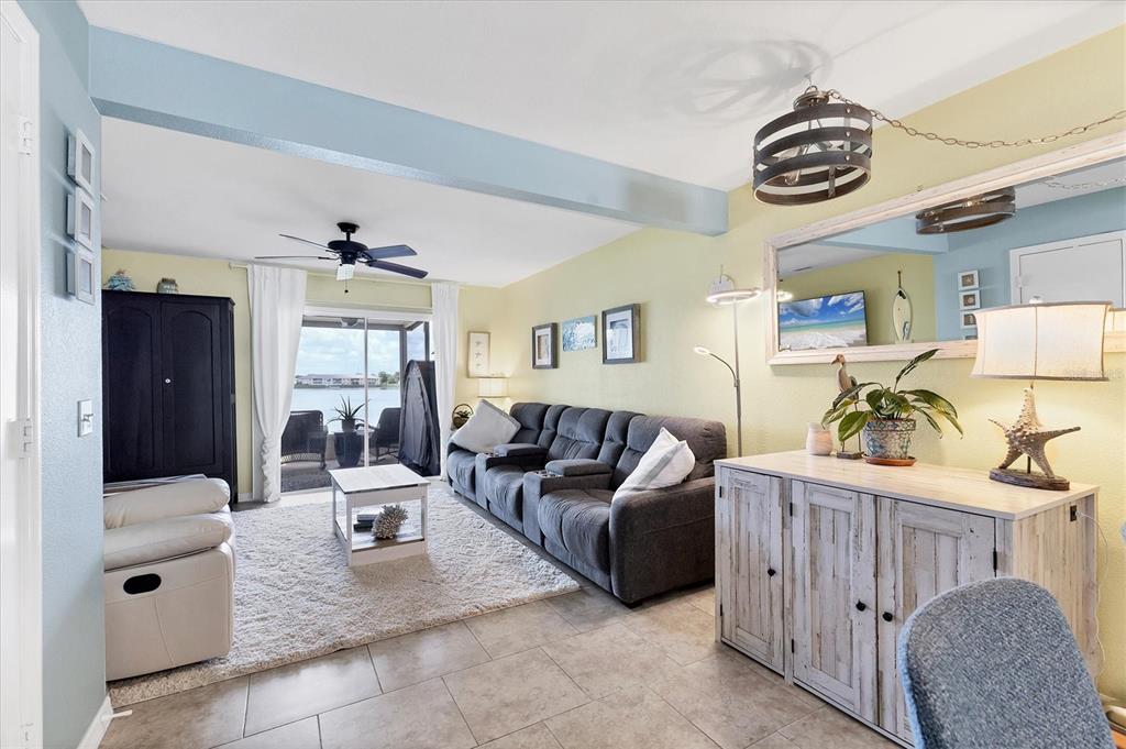 26310 Rampart Boulevard, Unit D504 Punta Gorda, FL 33983 - Photo 9 of 46 a living room with furniture and a table