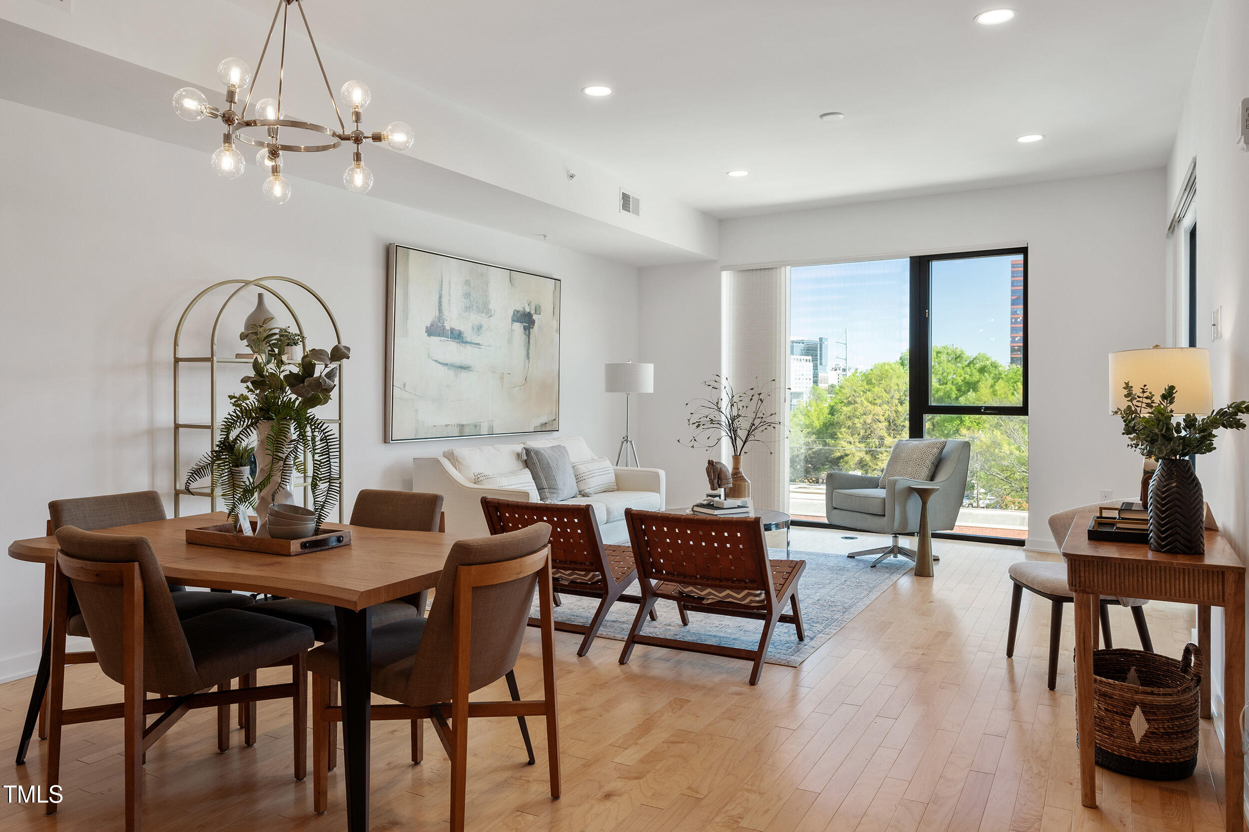 523 South West Street, Unit 404 Raleigh, NC 27601 - Photo 34 of 34 a view of a dining room with furniture window and wooden floor