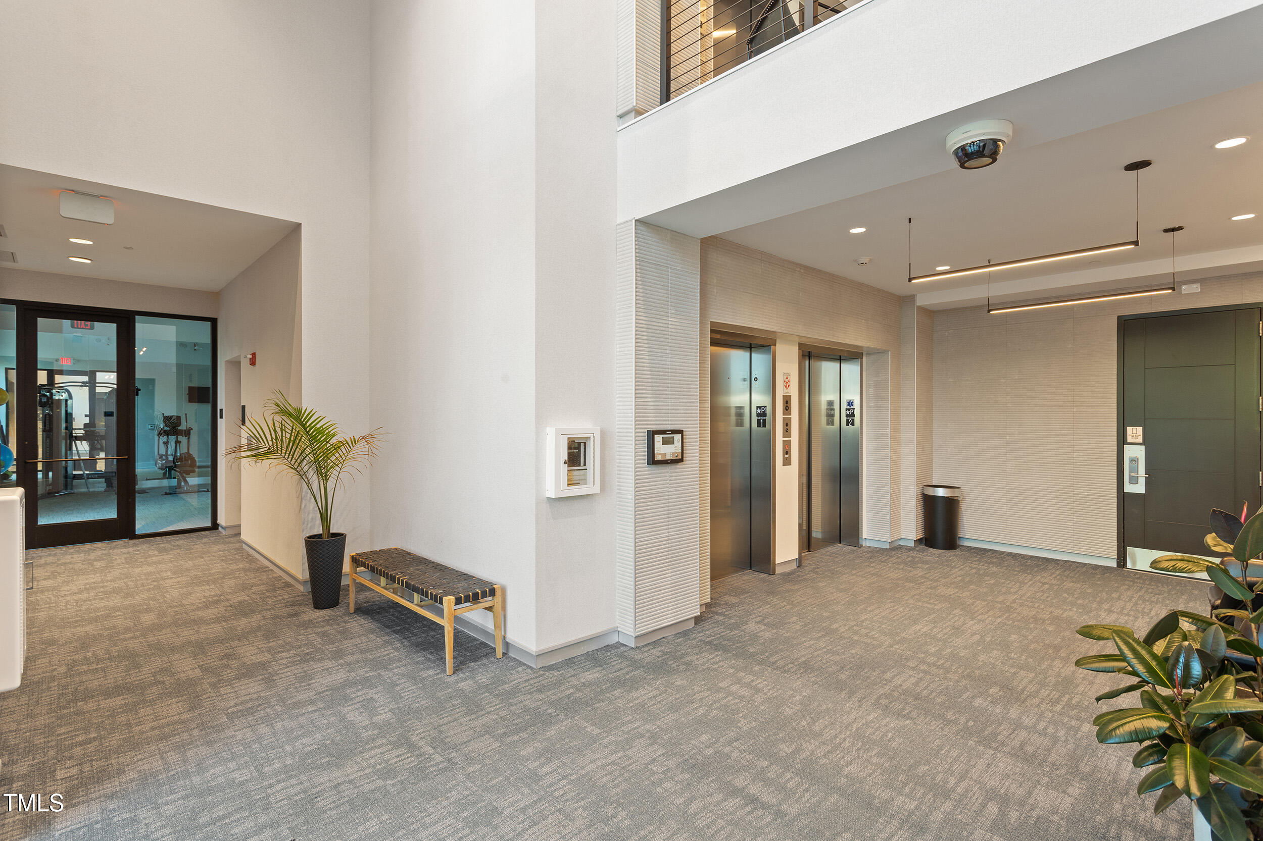 523 South West Street, Unit 404 Raleigh, NC 27601 - Photo 23 of 34 a view of a livingroom with a staircase