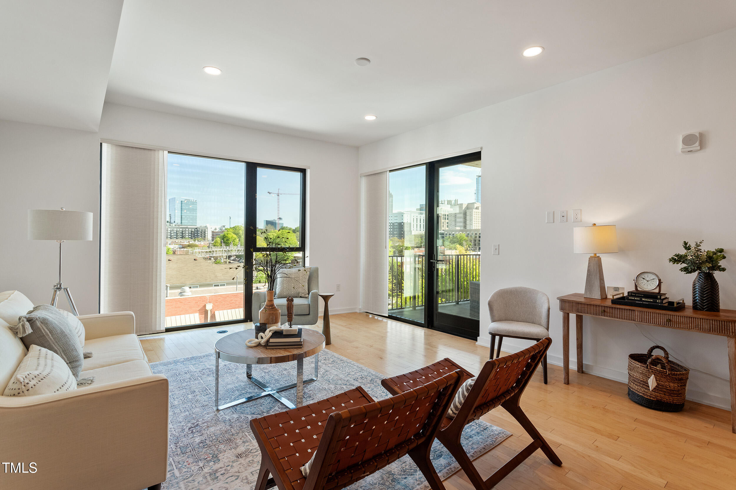 523 South West Street, Unit 404 Raleigh, NC 27601 - Photo 2 of 34 a living room with furniture and a large window