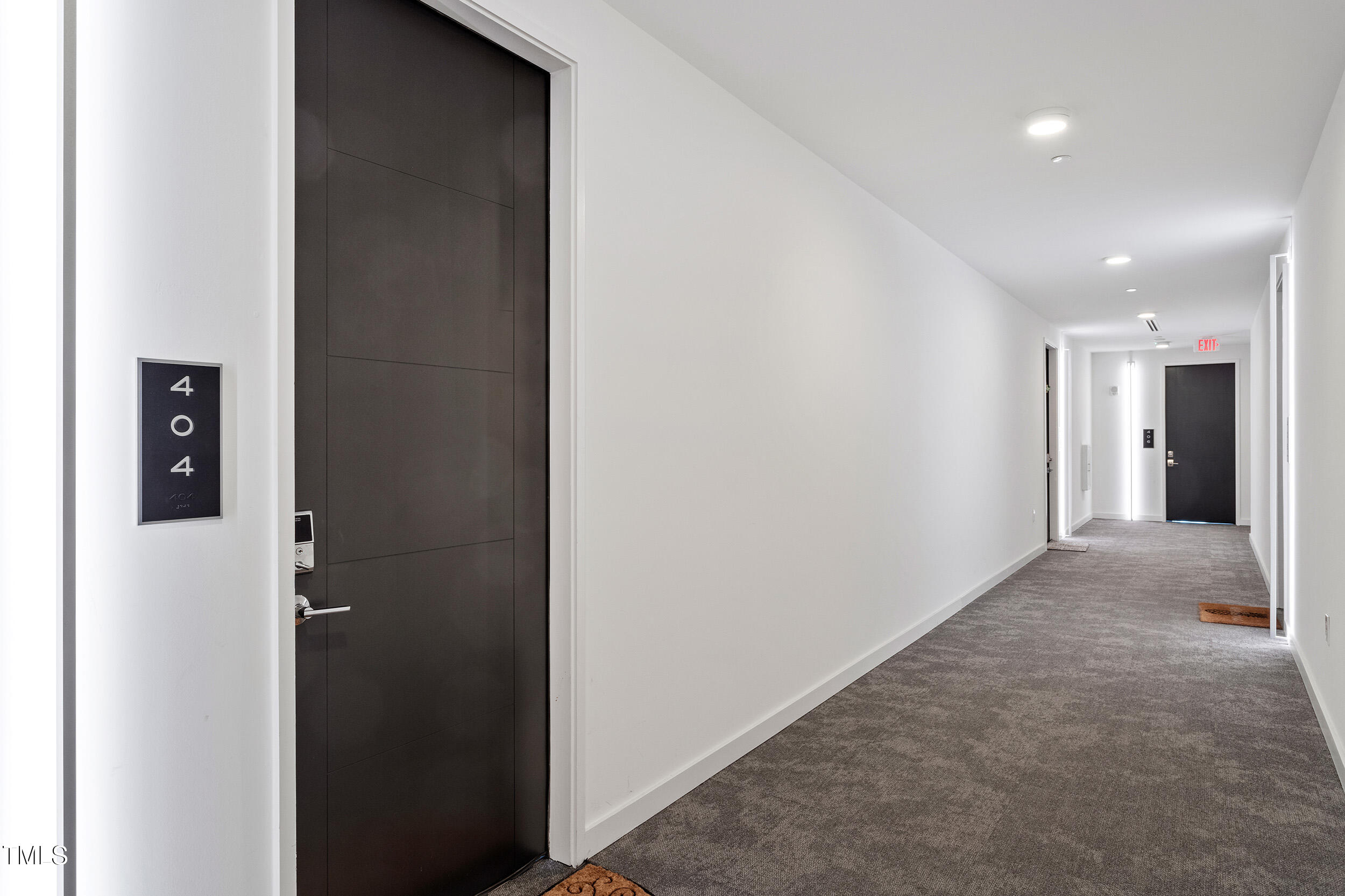 523 South West Street, Unit 404 Raleigh, NC 27601 - Photo 8 of 34 a view of a hallway with some shower
