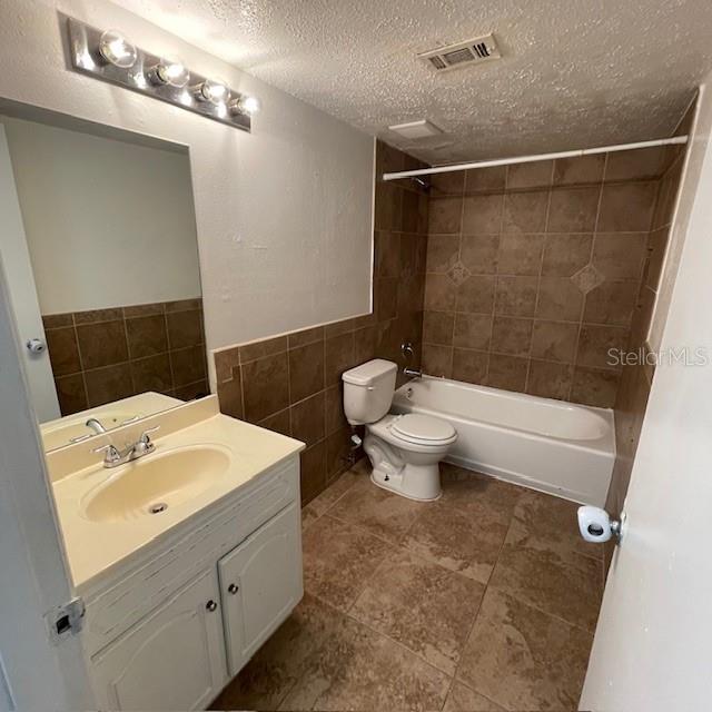 415 Wymore Road, Unit 101 Altamonte Springs, FL 32714 - Photo 11 of 15 a bathroom with a sink a toilet and shower