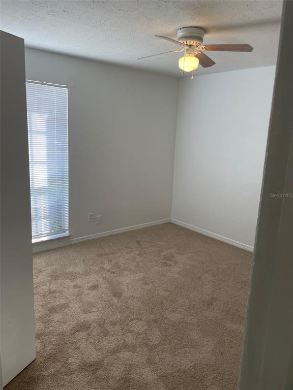 415 Wymore Road, Unit 101 Altamonte Springs, FL 32714 - Photo 14 of 15 an empty room with a window
