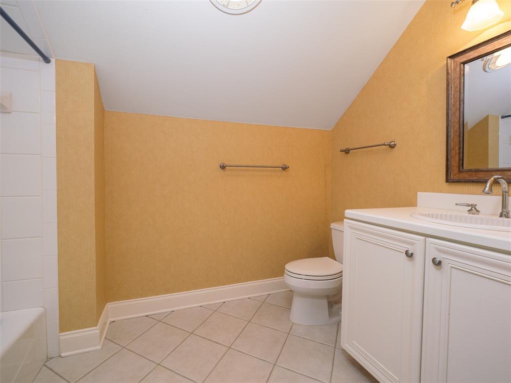 950 Southwest 43rd Place Ocala, FL 34471 - Photo 38 of 42 a bathroom with a sink a toilet and a mirror
