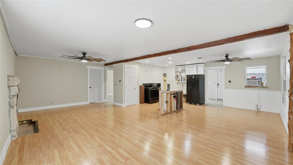 655 Northwest Nw Loop Smithville, TX 78957 - Photo 11 of 13 a view of a kitchen with a refrigerator and a sink