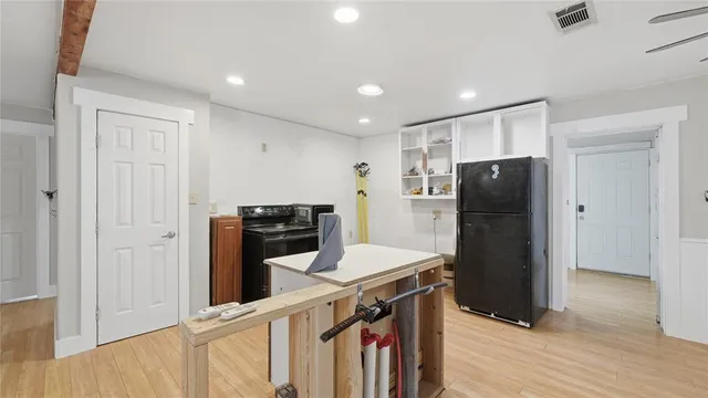 a view of hallway with wooden floor