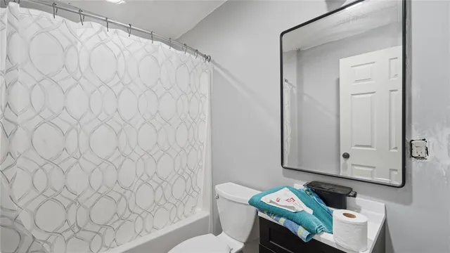 a view of livingroom with washer and dryer