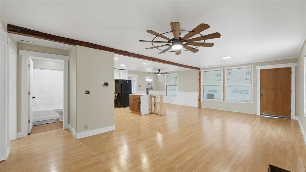 655 Northwest Nw Loop Smithville, TX 78957 - Photo 10 of 13 a view of empty room with wooden floor and ceiling fan