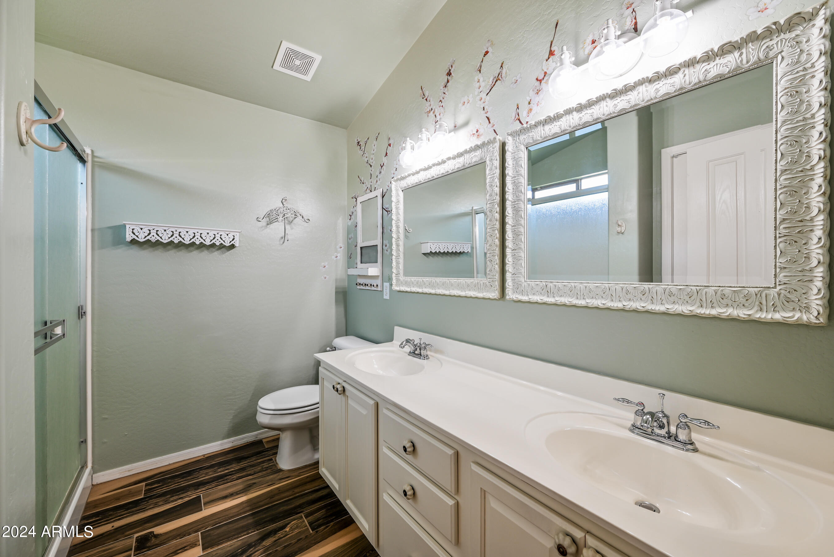 2992 East Blue Ridge Way Gilbert, AZ 85298 - Photo 13 of 25 a bathroom with a double vanity sink mirror and toilet