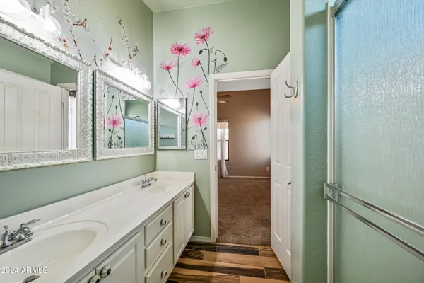 a bathroom with a sink and mirror