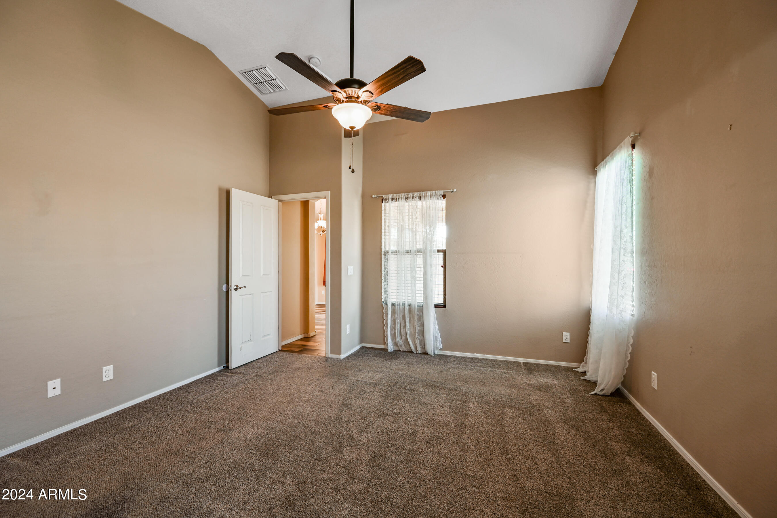 2992 East Blue Ridge Way Gilbert, AZ 85298 - Photo 15 of 25 an empty room with chandelier fan