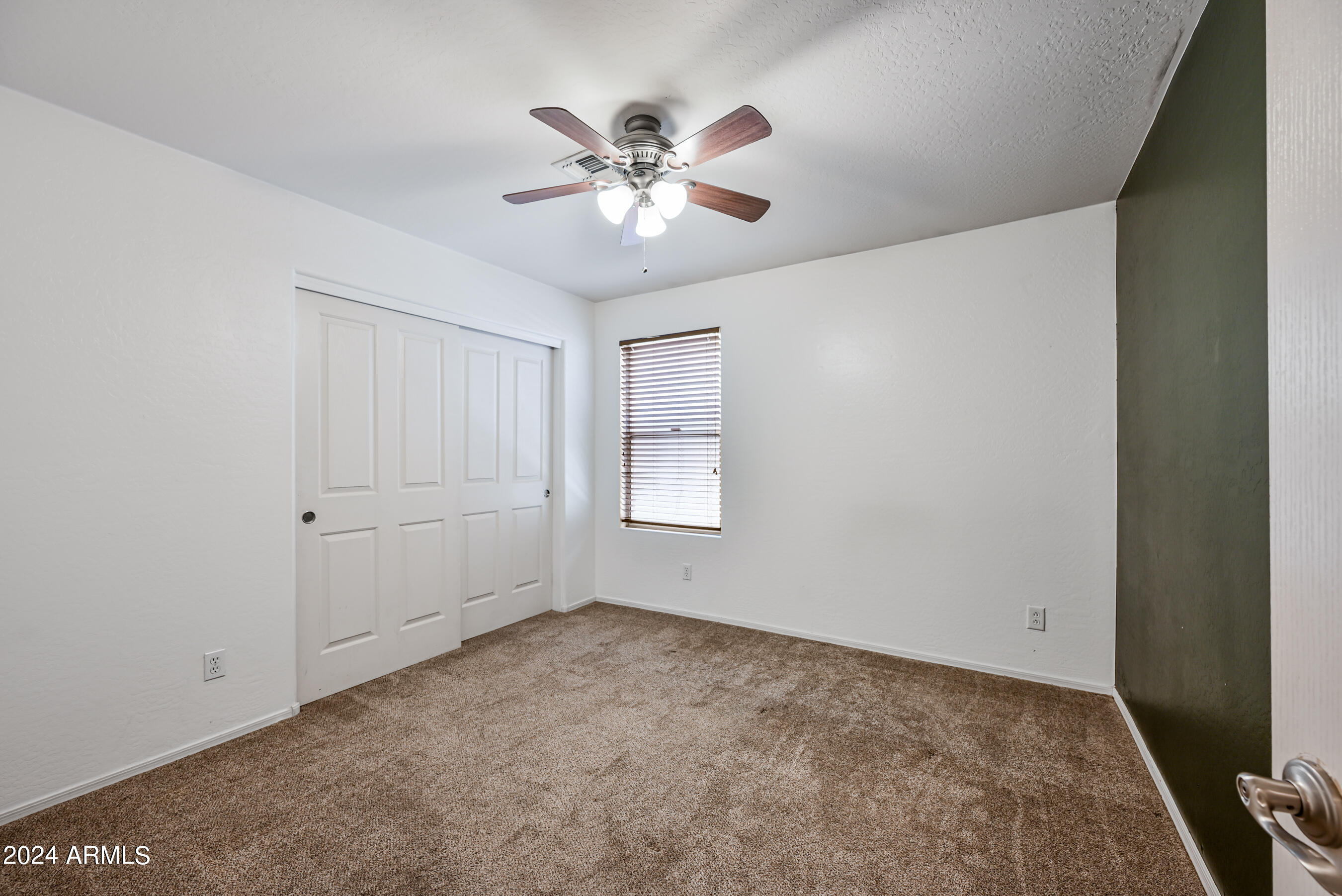 2992 East Blue Ridge Way Gilbert, AZ 85298 - Photo 17 of 25 a view of an empty room with a window