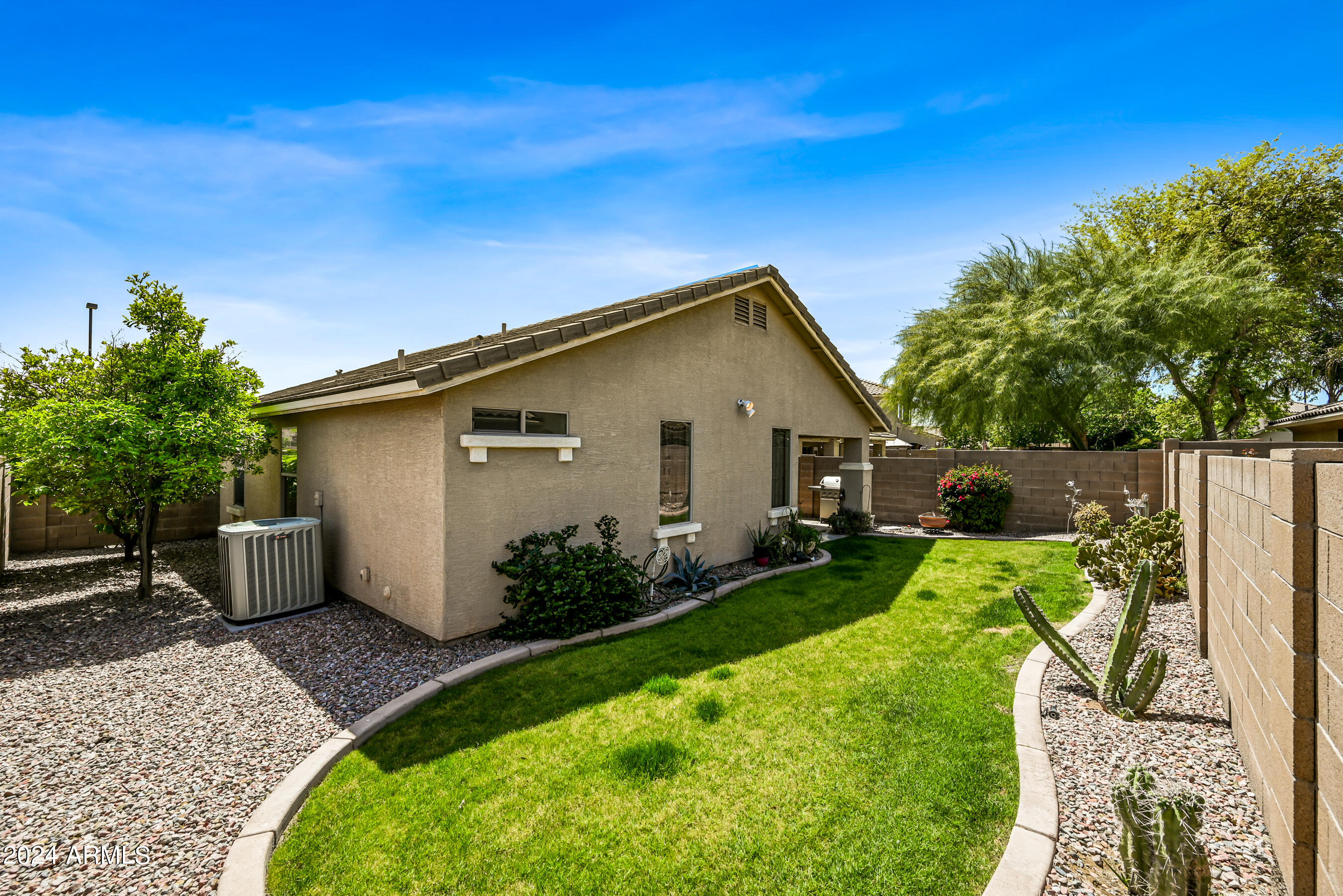 2992 East Blue Ridge Way Gilbert, AZ 85298 - Photo 25 of 25 a view of an house with backyard space and garden