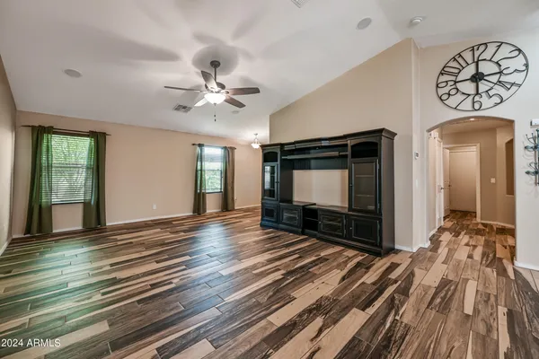 a view of livingroom with hardwood floor and a ceiling fan