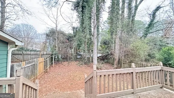 a balcony with trees in front of it