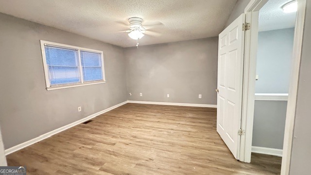 1115 Country Club Place Kennesaw, GA 30144 - Photo 10 of 13 a view of an empty room with wooden floor and a window