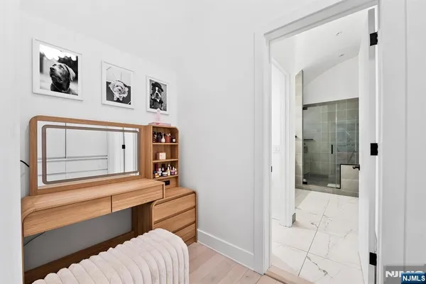 a bedroom with furniture and baby