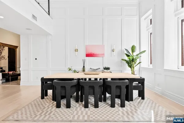 a room with a table and chairs in it