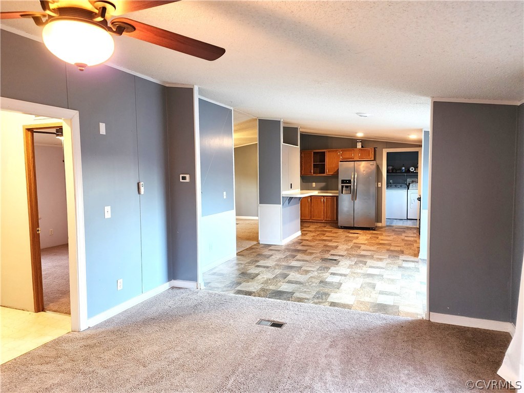 1609 Jeter Road Powhatan, VA 23139 - Photo 13 of 30 a view of a livingroom with a kitchen space and a window