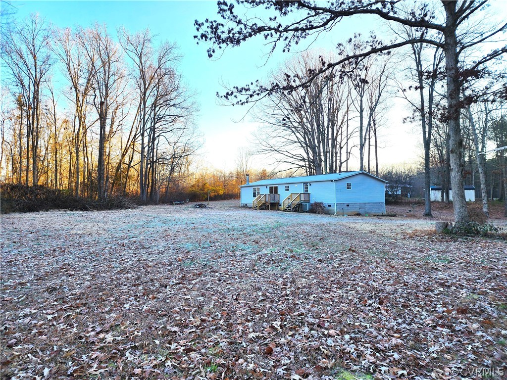 1609 Jeter Road Powhatan, VA 23139 - Photo 2 of 30 a backyard of a house with lots of green space