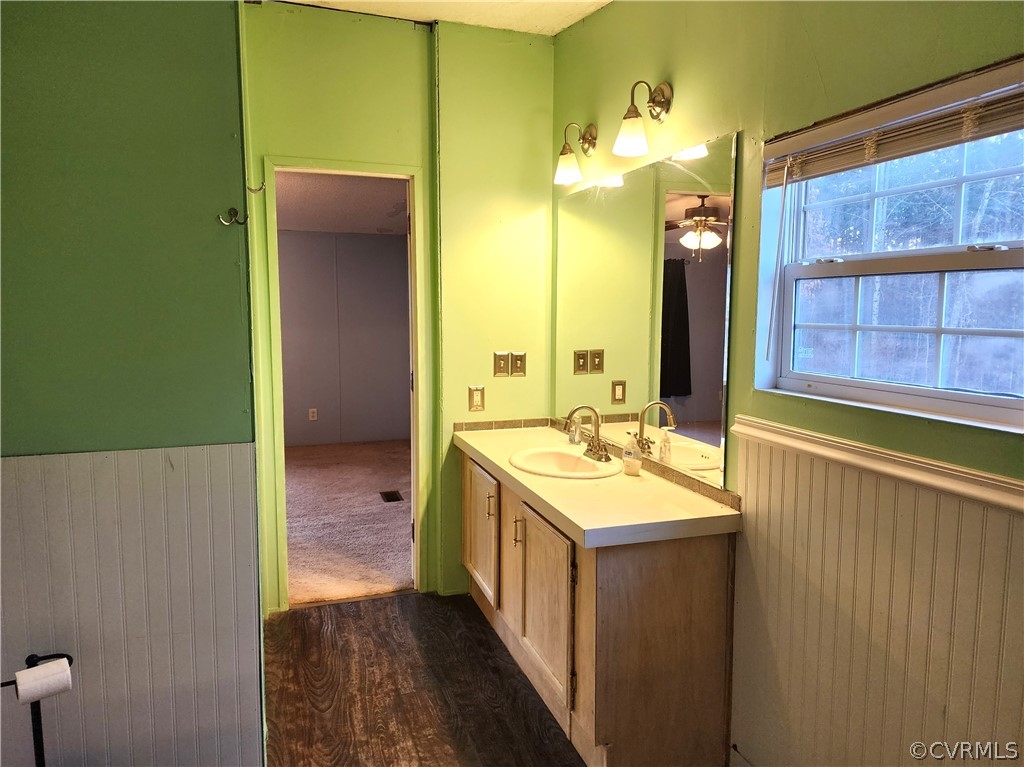 1609 Jeter Road Powhatan, VA 23139 - Photo 21 of 30 a bathroom with a double vanity sink and a mirror