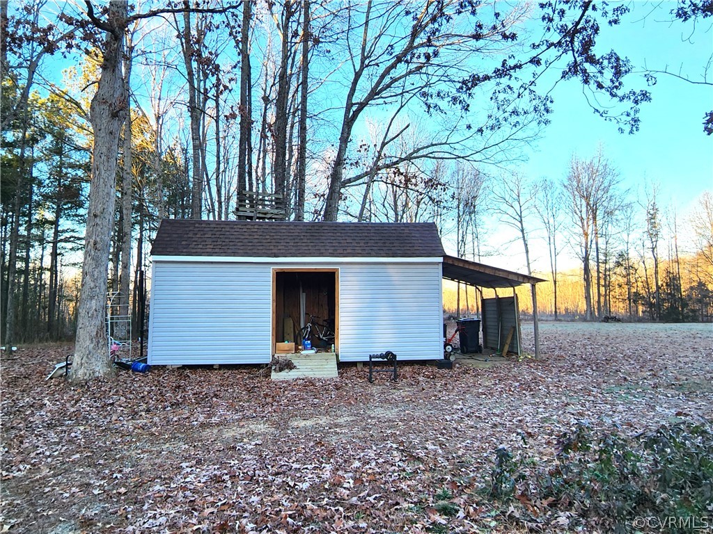 1609 Jeter Road Powhatan, VA 23139 - Photo 27 of 30 a view of backyard with large trees and barn