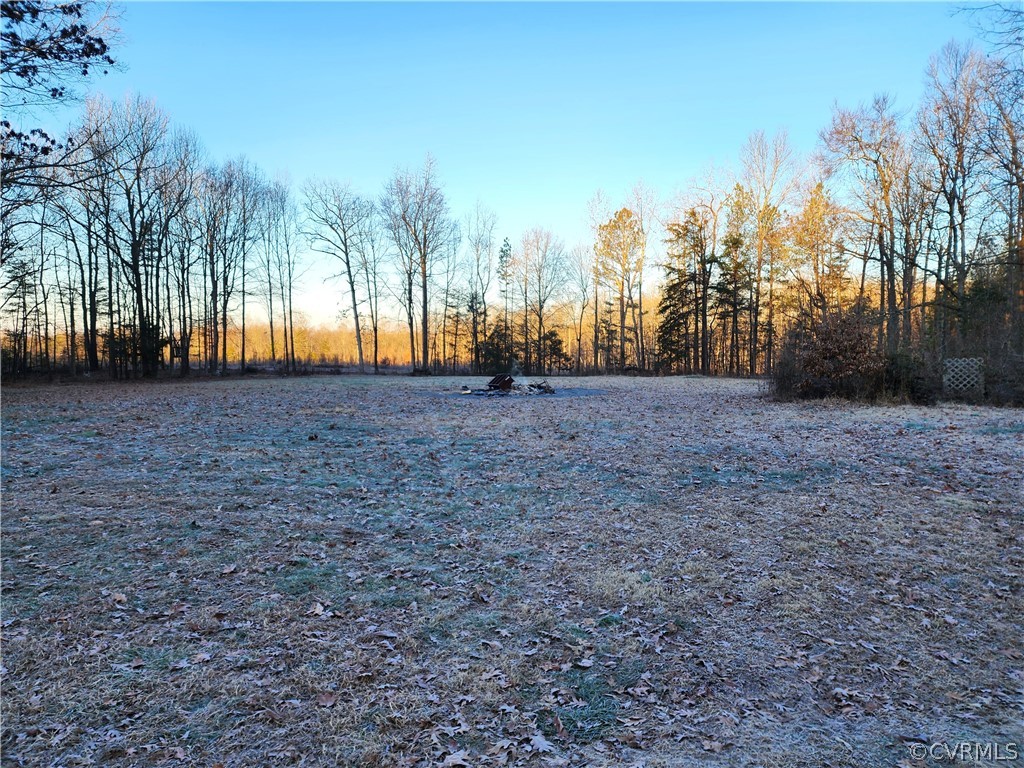 1609 Jeter Road Powhatan, VA 23139 - Photo 28 of 30 a view of dirt field with trees in the background